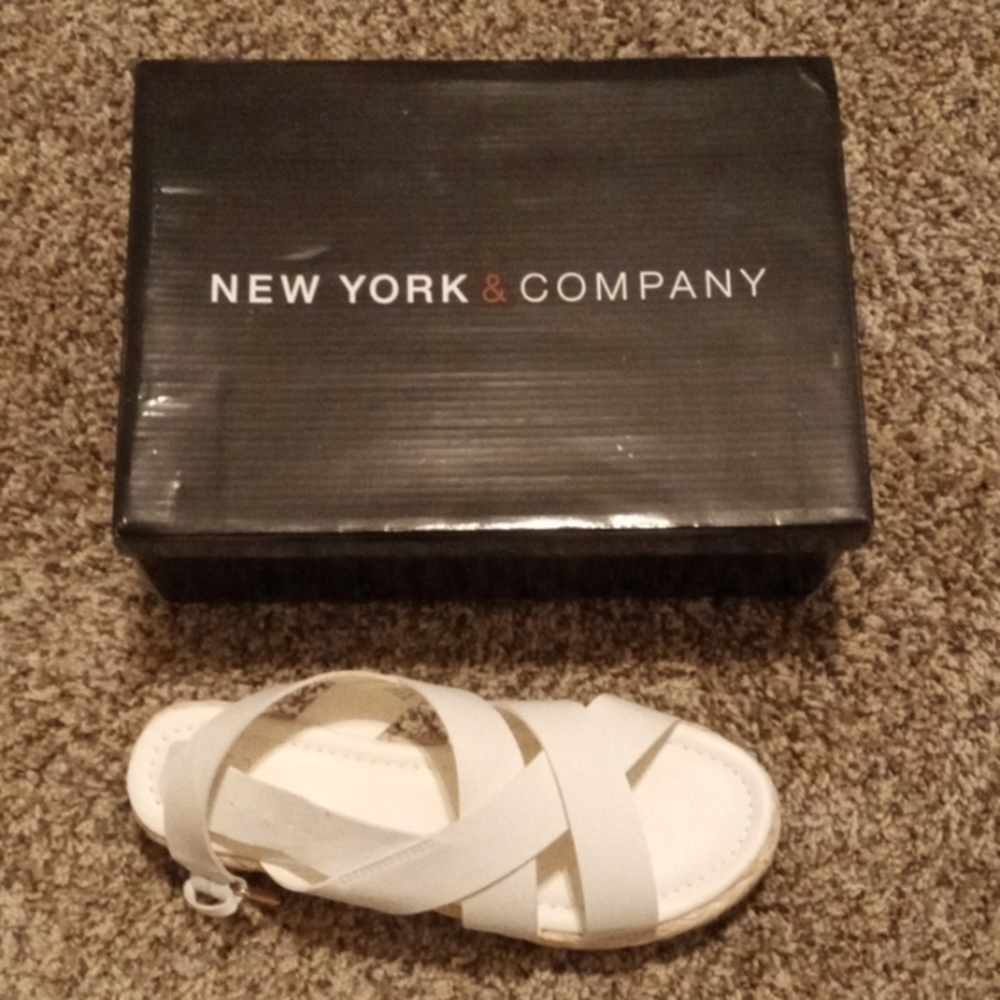 White sandals with buckle straps